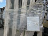 several pieces of wood are stacked on a pallet in a warehouse