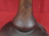 a vase that is sitting on a red cloth