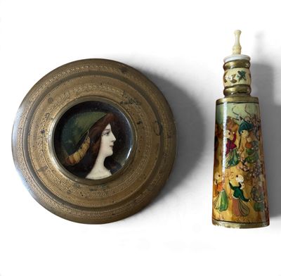 a picture of a picture of a woman in a hat next to a bottle of perfume