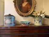 a picture of a painting on the wall above a dresser