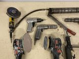 a lot of tools that are laying out on the floor