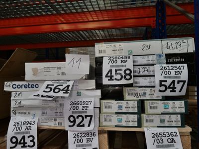a lot of boxes with price tags on them in a store