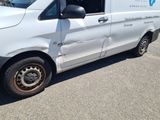 a van that has been vandalized and is parked in a parking lot