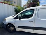 a white van that is parked in a parking lot