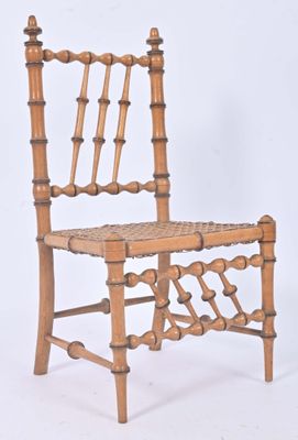 a wooden chair with a woven seat on a white background