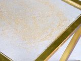 mirrored coffee table with gold metal frame and glass top