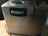 a toaster that is sitting on a wooden table