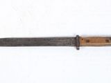 a knife that is laying on a white surface