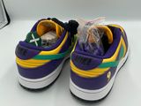 a close up of a pair of purple and yellow sneakers