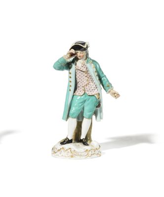 pair of figurines of a gentleman and a woman on a pedestal