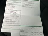 a paper that has a picture of a person ' s name on it