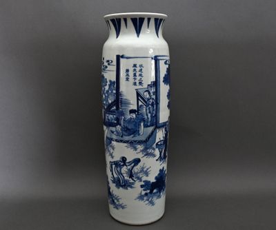 a blue and white vase sitting on a table