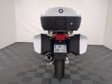 a motorcycle that is parked in a room with a checkered floor