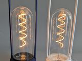 two lamps that are sitting next to each other on a table