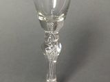 a wine glass that is sitting on a table