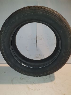 a close up of a tire on a white surface in a room