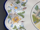 a plate that has a picture of a house on it