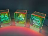three cubes that have been lit up with neon lights