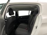 the back seat of a white car with the door open