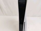 a close up of a black and white device on a white surface