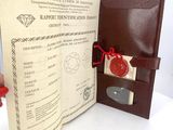 a brown leather passport case with a red wax stamp on it