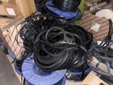 a pile of wires and other electrical equipment on a pallet