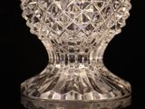 a glass vase that is sitting on a table