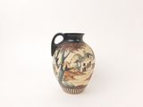 a small vase with a painting on it sitting on a table