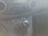 a dashboard of a car with a steering control