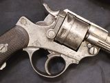 a gun that is sitting on a black cloth