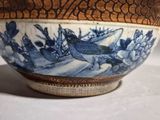 a blue and white bowl sitting on a table