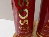 two bottles of shampooe sitting on a cutting board
