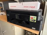 an image of a printer sitting on top of a desk