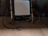 a small television sitting on top of a wooden floor