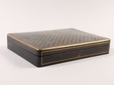 an image of a black and gold box on a white background