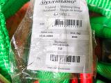 a green bag with some red scissors inside of it