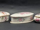 several pieces of porcelain are sitting on a black surface