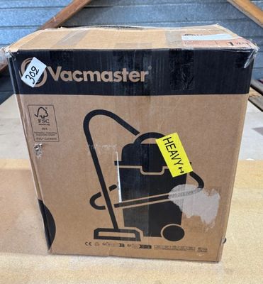 une boîte sur laquelle est posé un aspirateur
