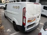 a white van that is parked in a parking lot