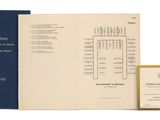 an open book with a picture of a bunch of papers on it