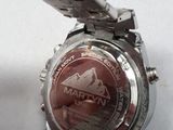 a close up of a watch on a table