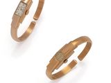 an image of two gold rings with diamonds on them