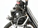 a close up of a motorcycle with a motorbike attached to it