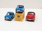 three toy cars that are sitting on top of a box