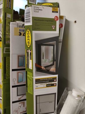 a stack of boxes of windows in a store