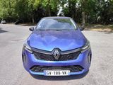 the front view of a blue car parked in a parking lot