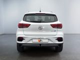 the rear end of a white car in a white room