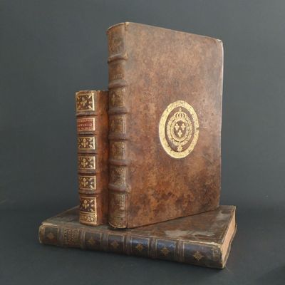 two books sitting on top of each other on a table