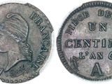 an old coin with a woman ' s head on it