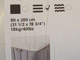 a picture of a box with a mattress inside of it